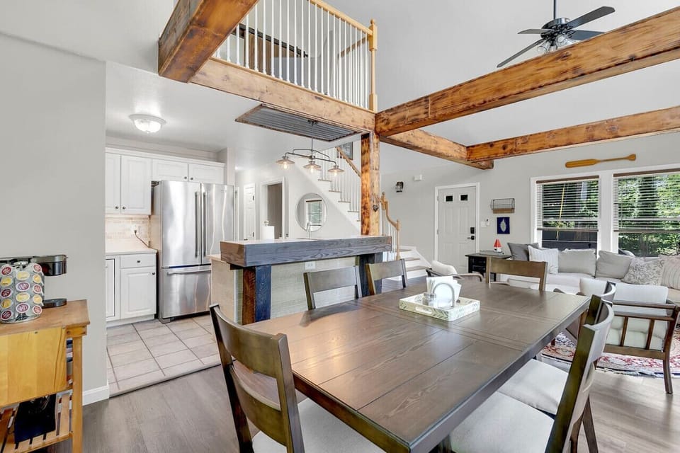 Dining table with seating for six located off the kitchen & living room.