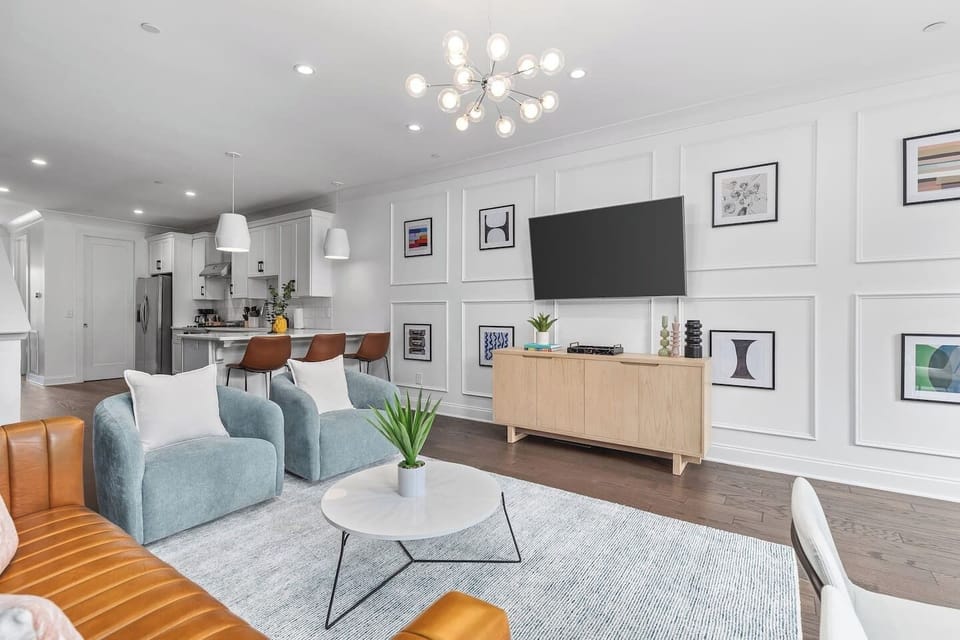 Smart TV in the living room with all the streaming apps. Lots of natural light and plenty of seating for your comfort.