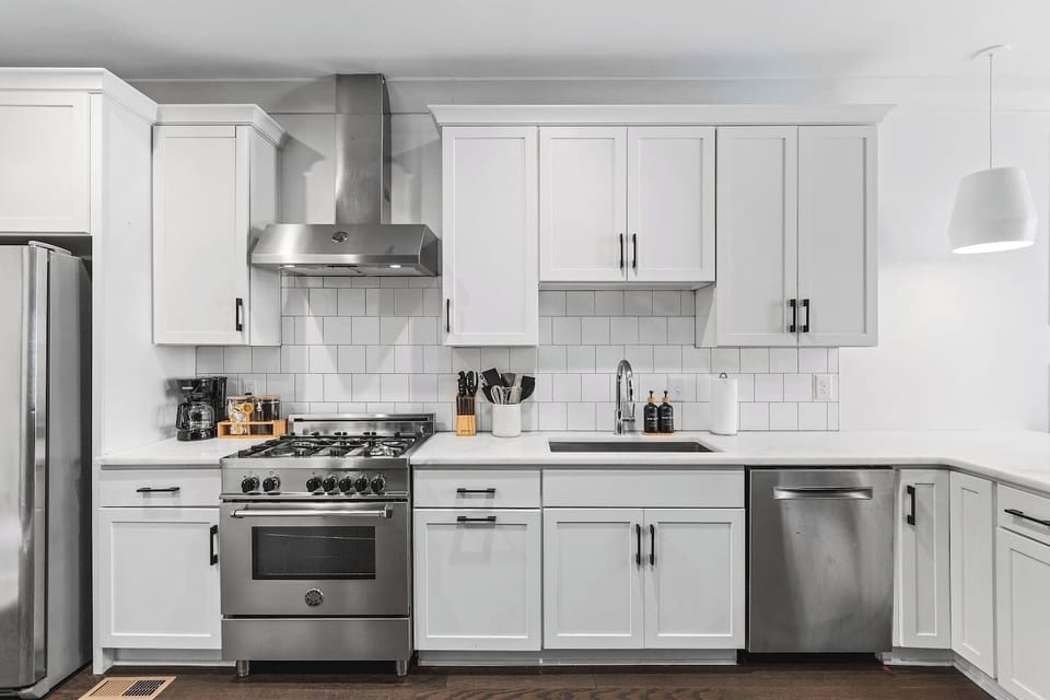High-end appliances and all the cooking supplies you might need in this fully equipped kitchen with seating for three at the counter.