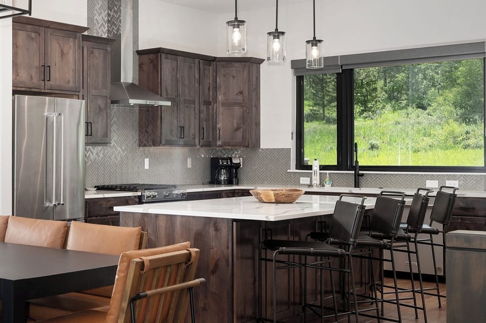 Open concept main level with dining area and large, fully equipped kitchen
