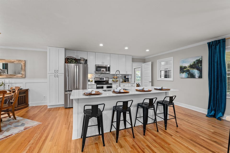 Fully stocked kitchen with 4 bar seats