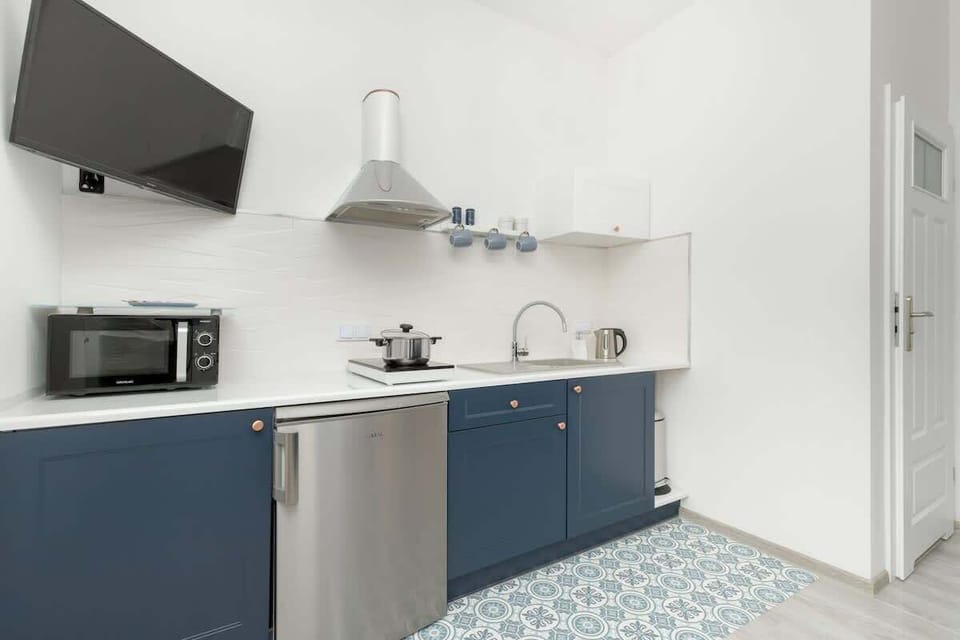 Kitchenette with television.