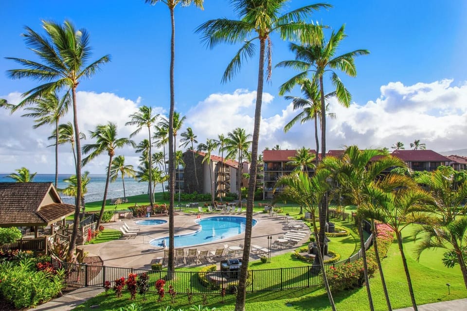 The tropical landscaping frames the spacious oceanfront pool area, the perfect place to relax at Papakea.