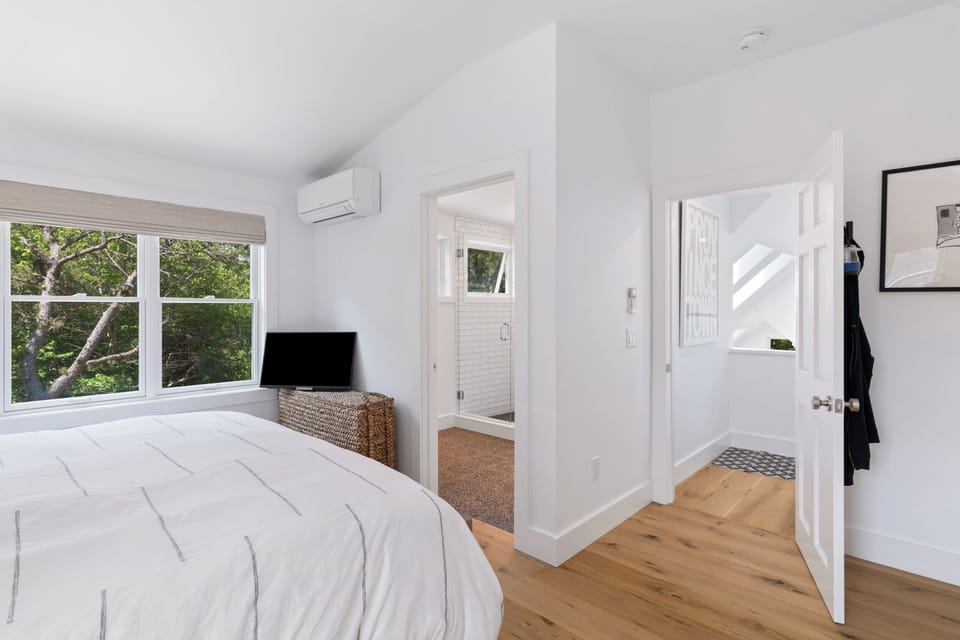 View of Primary bedroom with king bed into Primary Bathroom