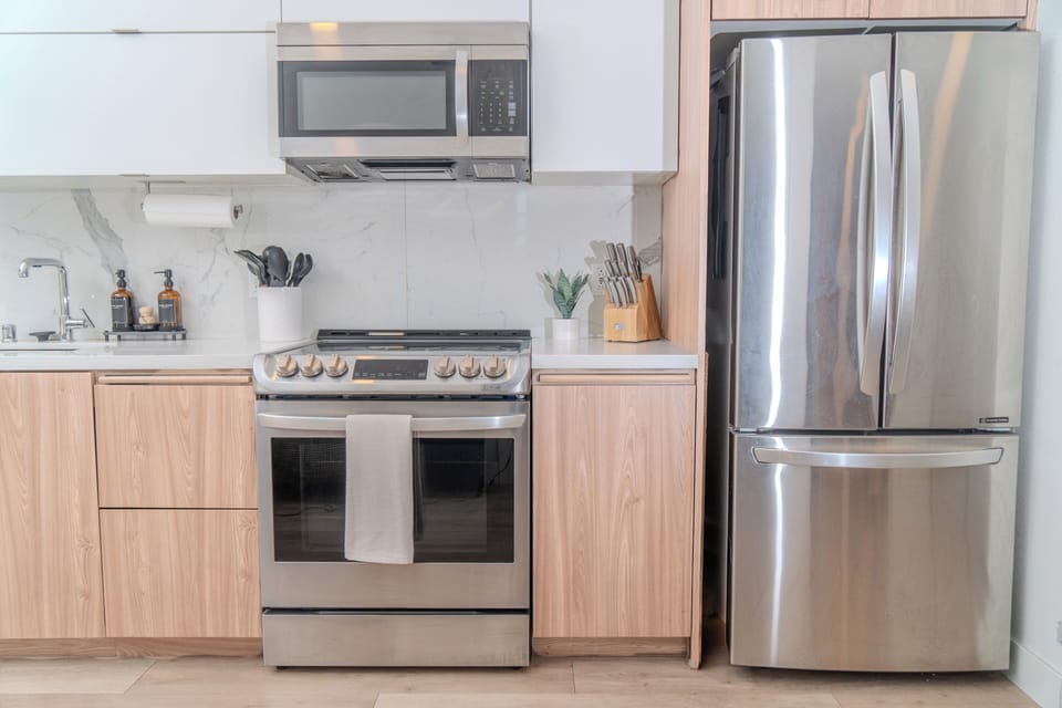Kitchen with stainless steel appliances and essentials