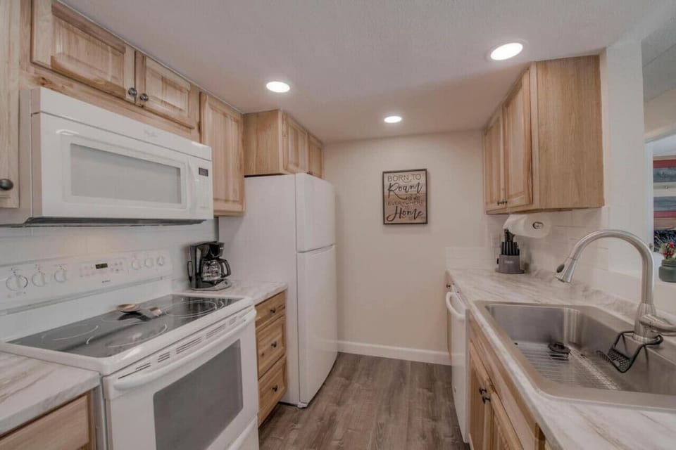 Fully Stocked Kitchen - Pots/Pans/Skillets, Utensils, Blender, Toaster, Electric Griddle, Baking Dishes, Mixing and Serving Bowls, Plates/Cups/Silverware, Wine Glasses, Serving Pieces, Knife Block, and More
