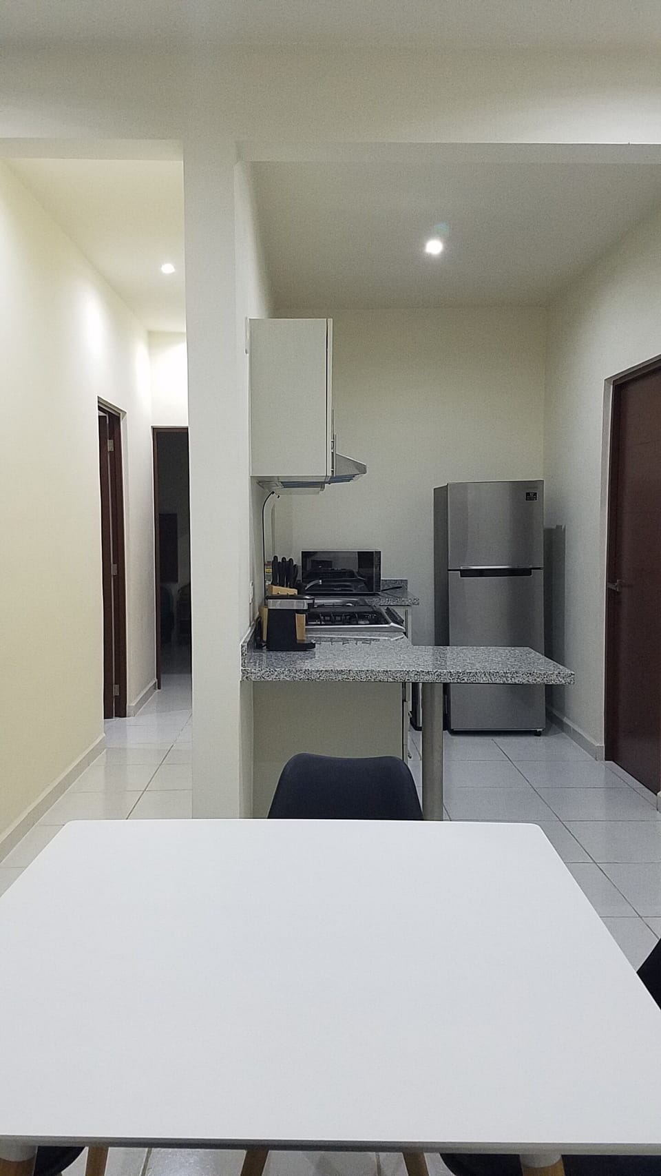 Another view of the kitchen and hallway.