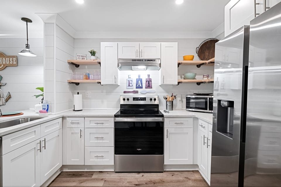 The kitchen has plenty of lighting for all your cooking needs. 