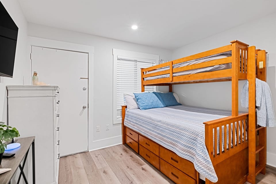 Bedroom 2 with queen bunk bed and 2 twin beds. There is also a dresser and a closet for your use. 
