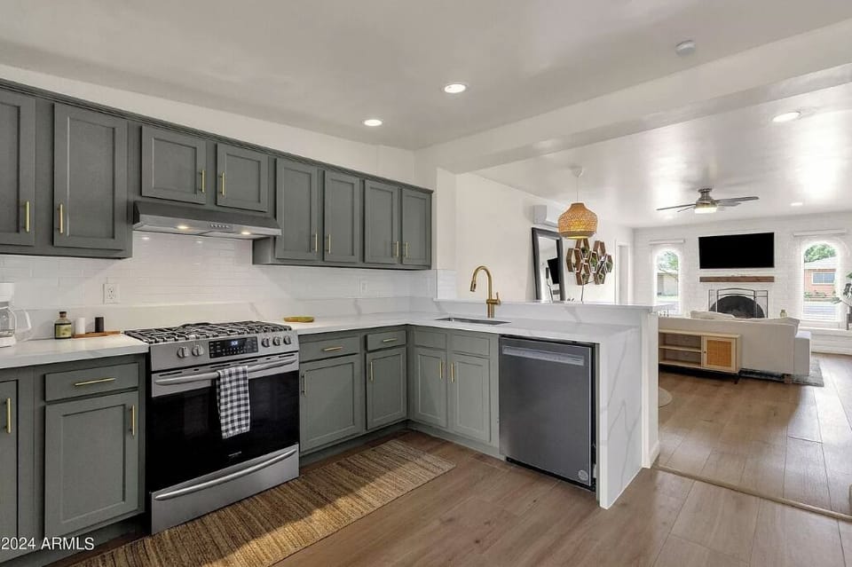 The kitchen has a full size gas range, dishwasher, garbage disposal and pantry.