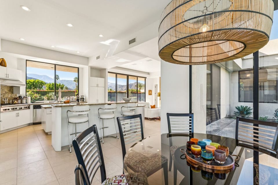 Open kitchen & dining area w/ island seating & seamless flow for gatherings