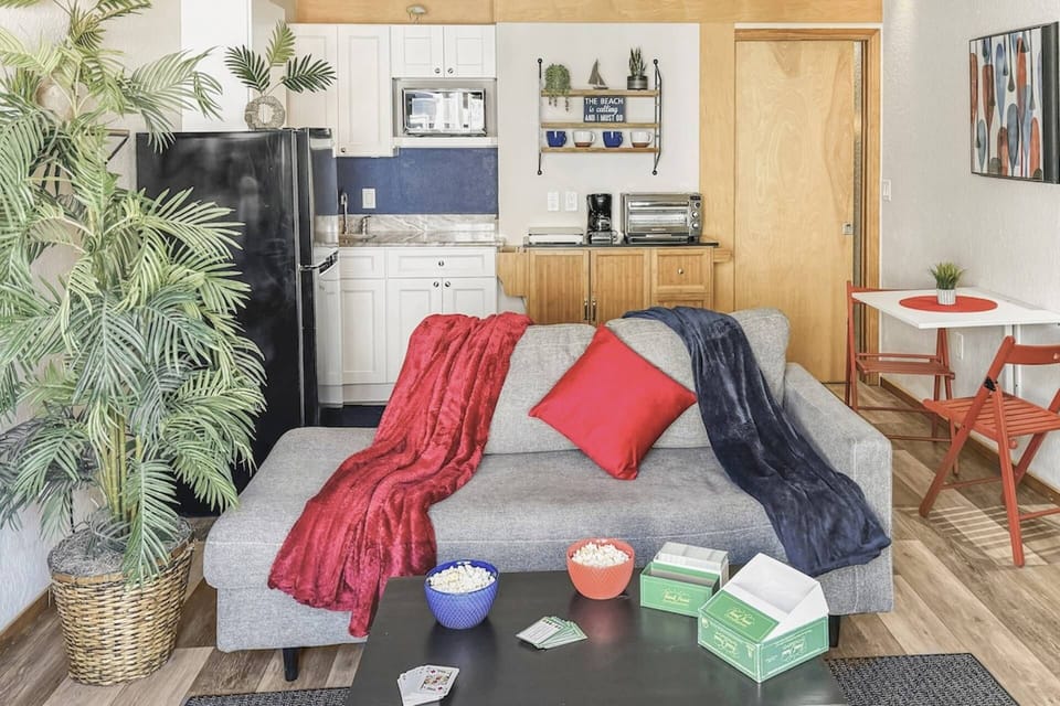 Cozy up in the living room, perfect for movie nights. Enjoy some popcorn in hand, and relax while watching your favorite show.