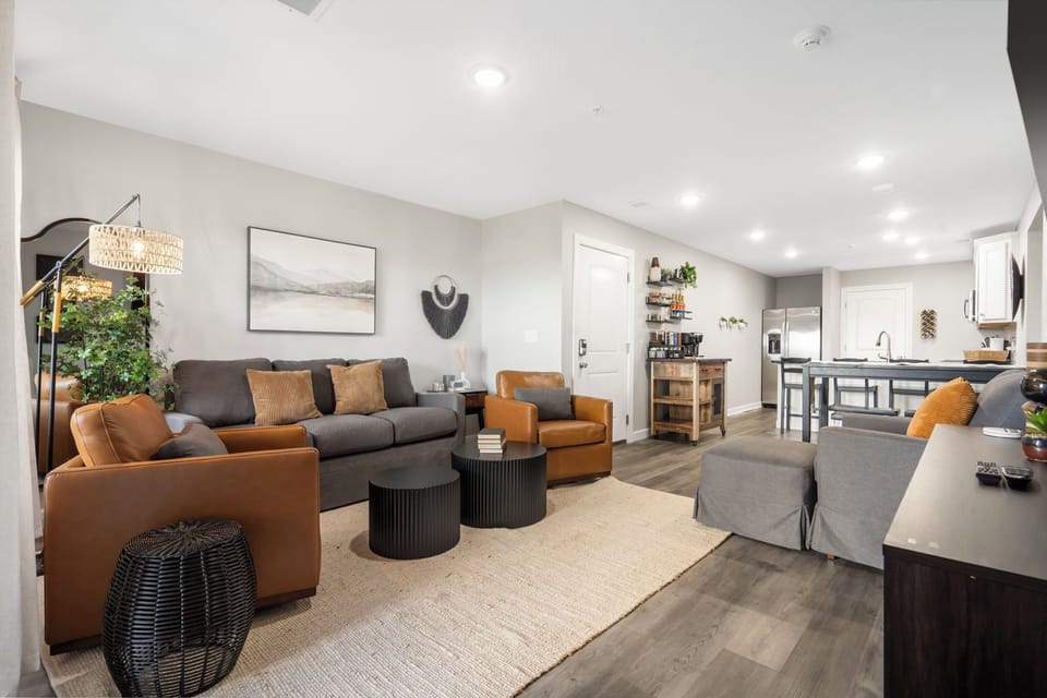 The Open Floor Plan Includes a Fully Equipped Kitchen with a Dining Table and Extra Bar Seating, a Coffee Bar, a Living Area with Cable TV, an Electric Fireplace, Deck Access, 2 Bathrooms, and 3 Comfortable Bedrooms!