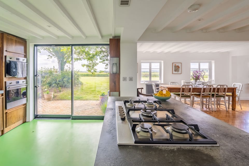 Ground floor: Sliding doors in the kitchen open to the courtyard