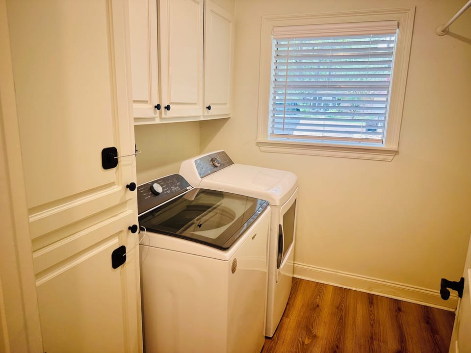 Full size washer and dryer in laundry room 
