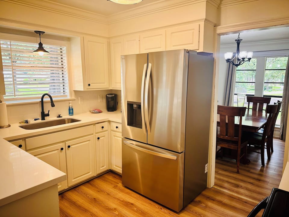 Full size refrigerator with ice maker and water dispenser. 