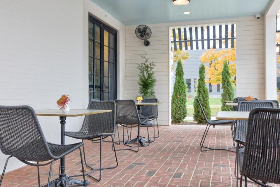 Sip coffee under the covered patio with comfortable seating.