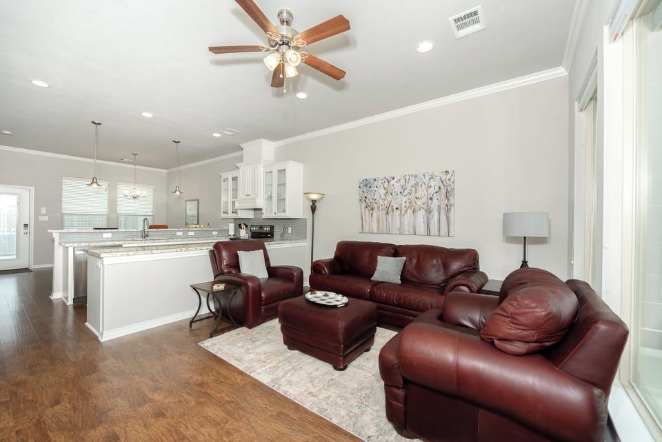 Living room with view towards kitchen and dining