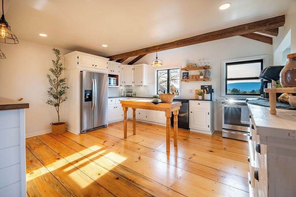 The large kitchen is located next to the living room so that no-one has to miss out on the fun!