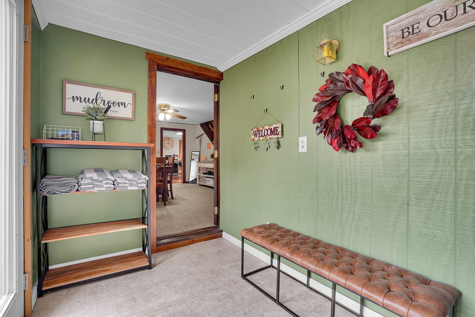 Mud room is accessible from dining room.