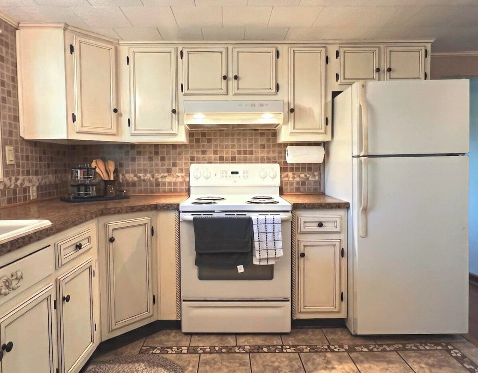 Beautiful, up-to-date kitchen. It's fully-stocked and perfect for any chef in the group to enjoy cooking any meal!