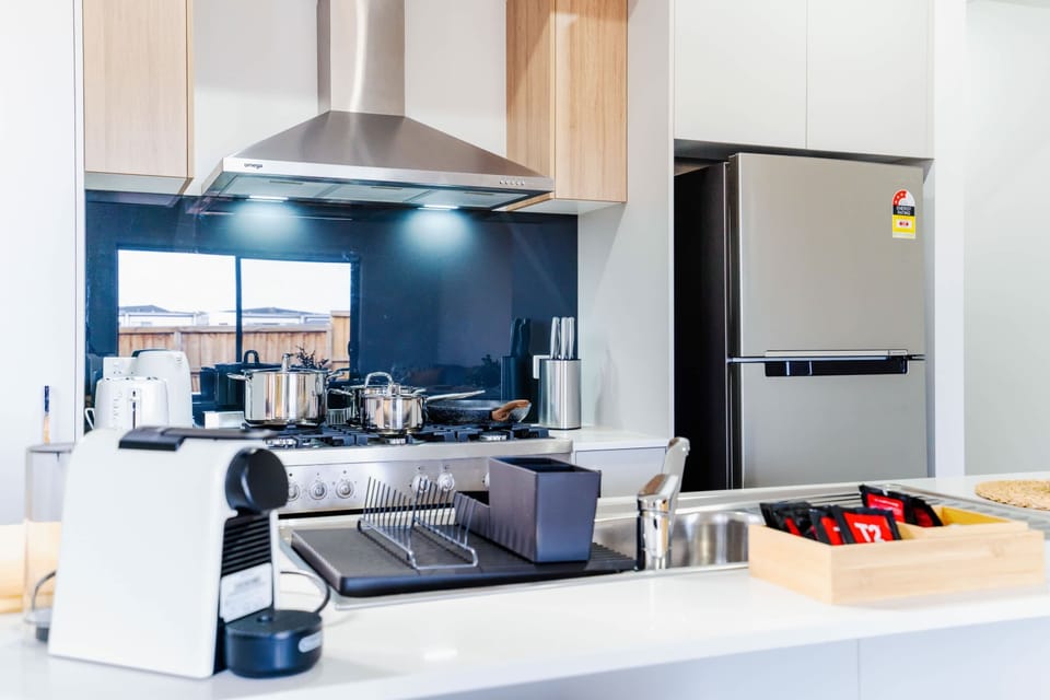 Contemporary kitchen with modern appliances and plenty of storage space.