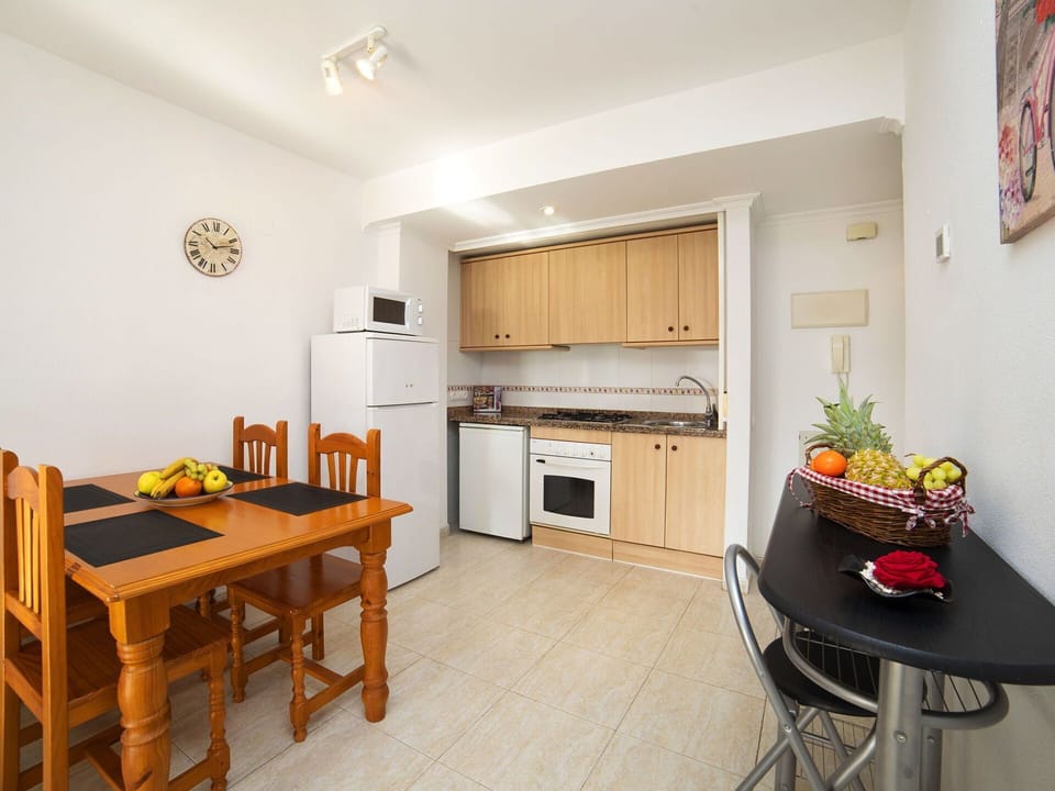 Table, Furniture, Cabinetry, Countertop, Chair, Kitchen Stove, Wood, Kitchen Appliance, Kitchen, Home Appliance