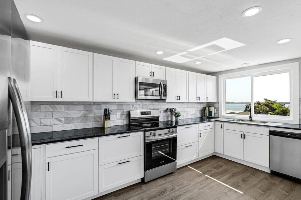 Fully equipped kitchen with stainless steel appliances and ample counter space