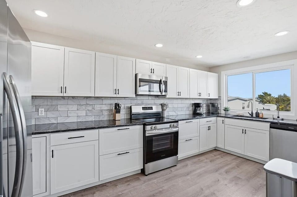Spacious kitchen with modern appliances.