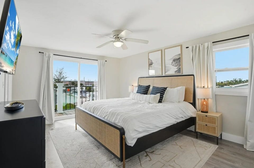 Spacious king bedroom with private deck access.