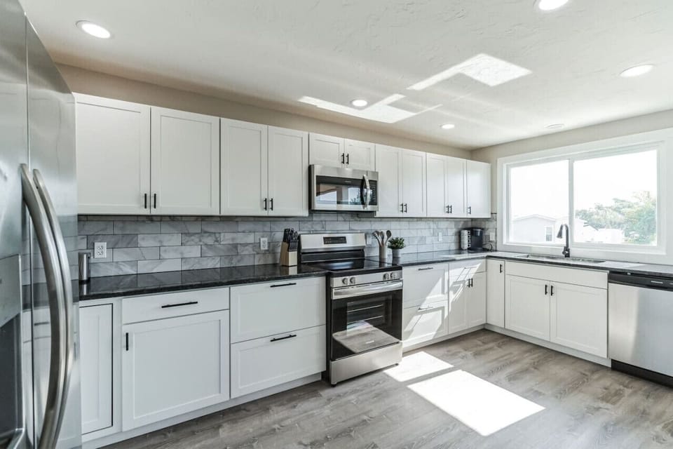 Fully equipped kitchen with stainless steel appliances and ample counter space