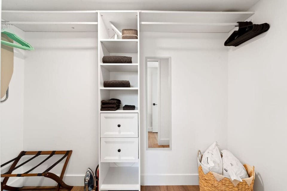 Bright walk-in closet w/ open shelving, drawers & plenty of space to unpack and settle in.