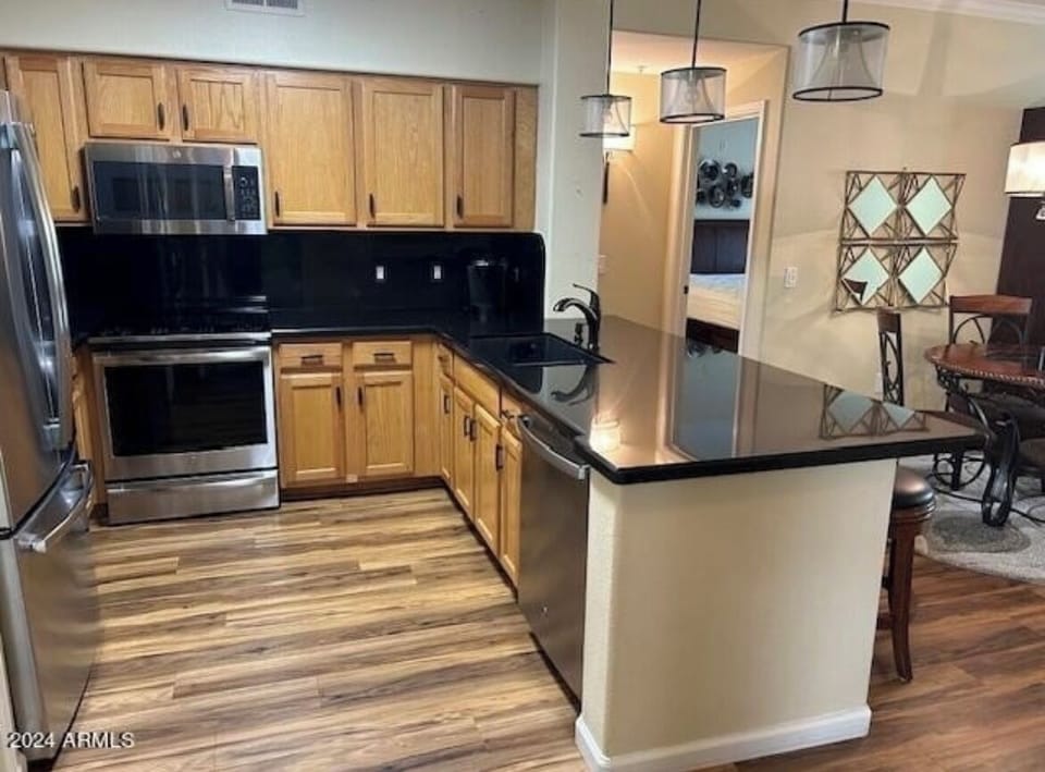 Full size kitchen with breakfast bar and separate dining area 