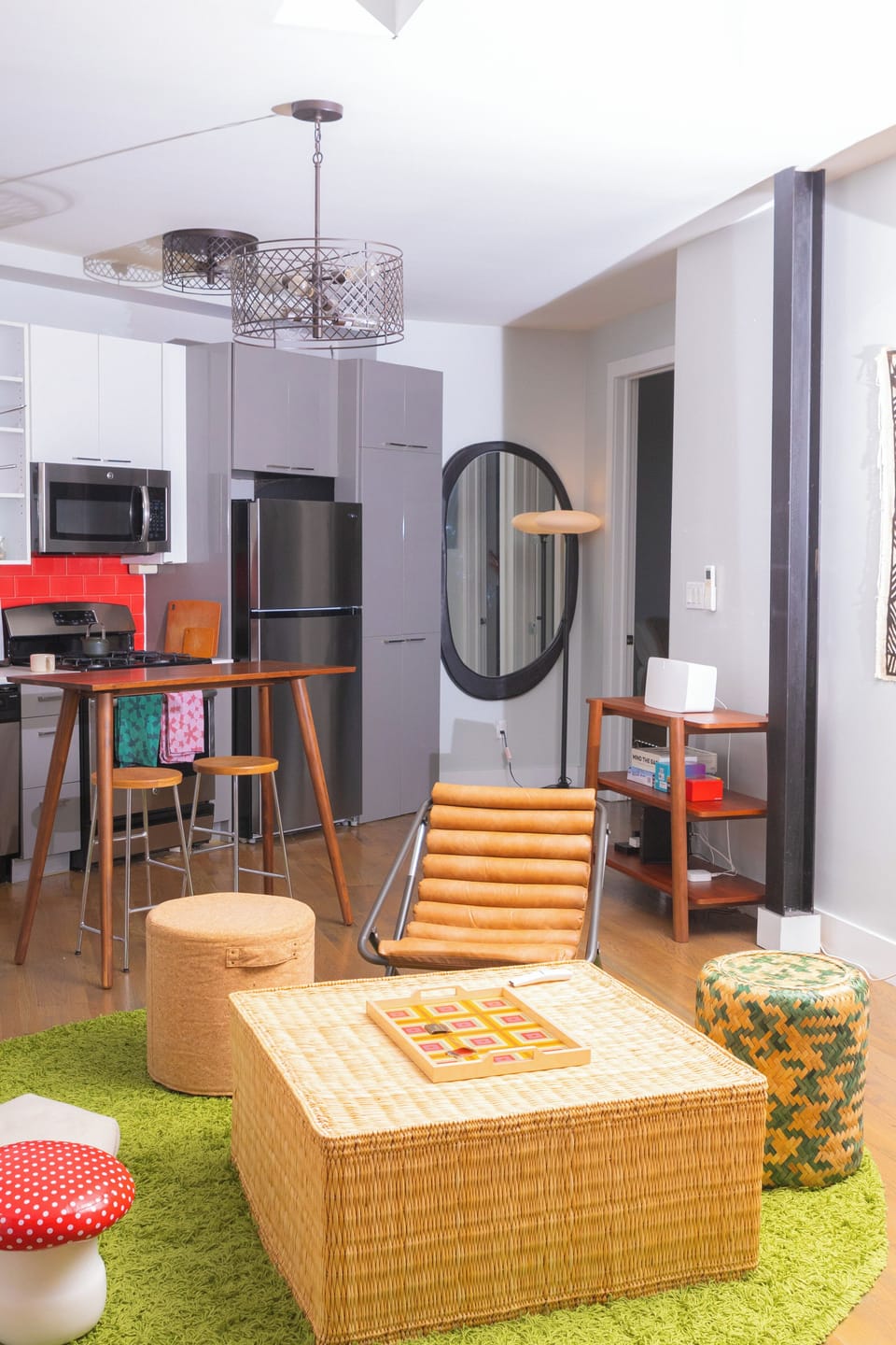 Modular living room lounge area featuring  Samsung TV and custom art & curation.