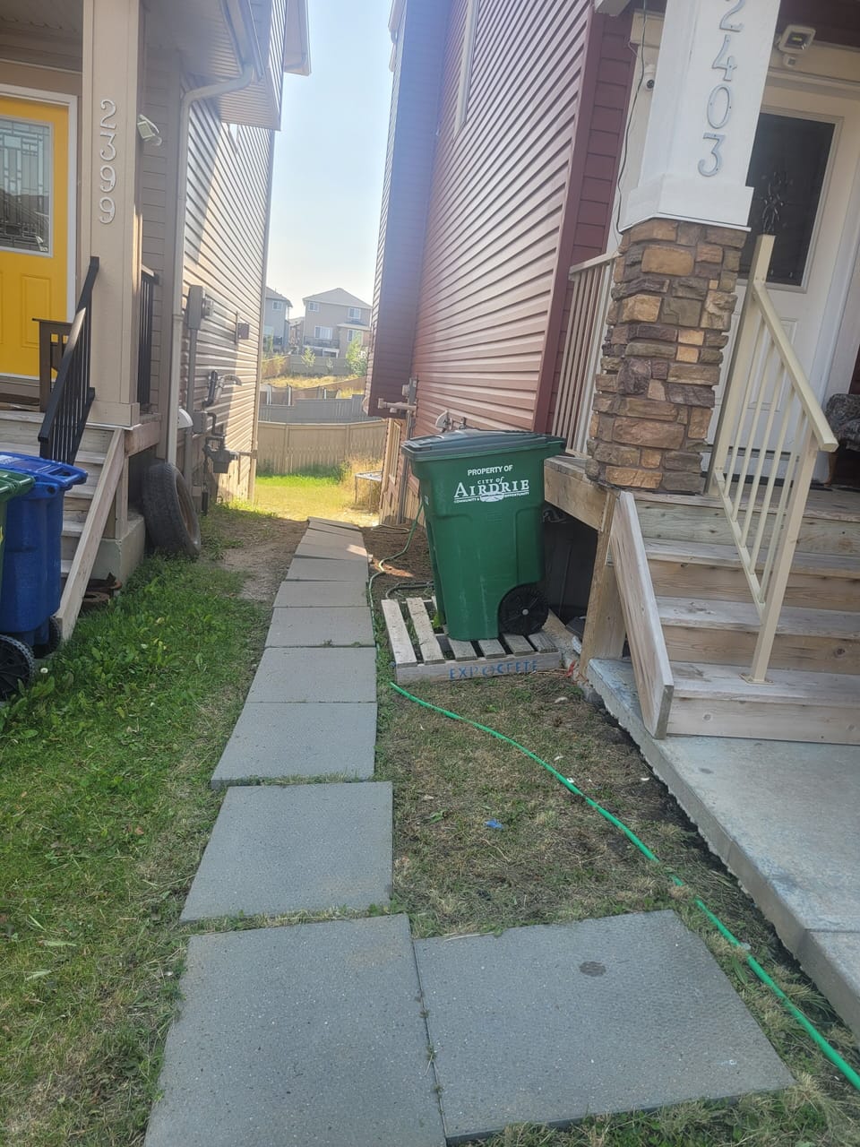 Way to the basement nest door at the back of the building.