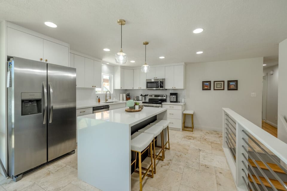 Modern kitchen with island seating and mountain charm.