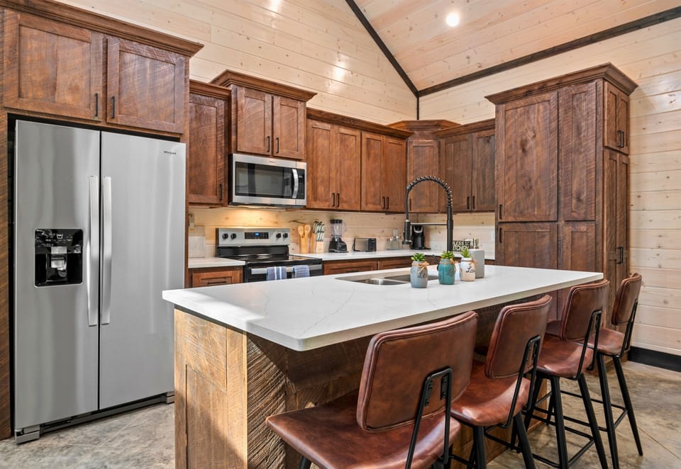 Enjoy cooking in this well-equipped kitchen, designed with a beautiful blend of modern and rustic elements.