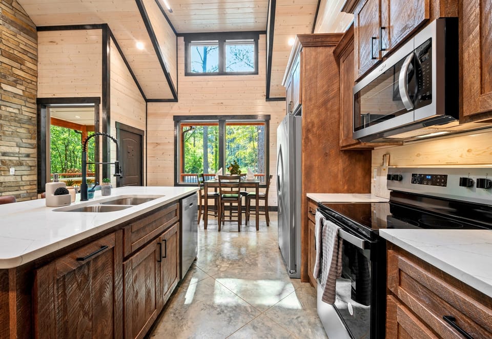 The kitchen's spacious layout and sleek design make it a perfect place for preparing meals and entertaining guests.