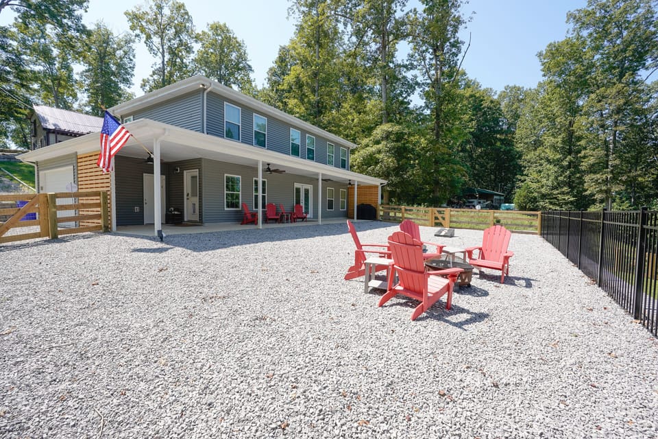 Outside area with firepit, grill, and patio furniture. 