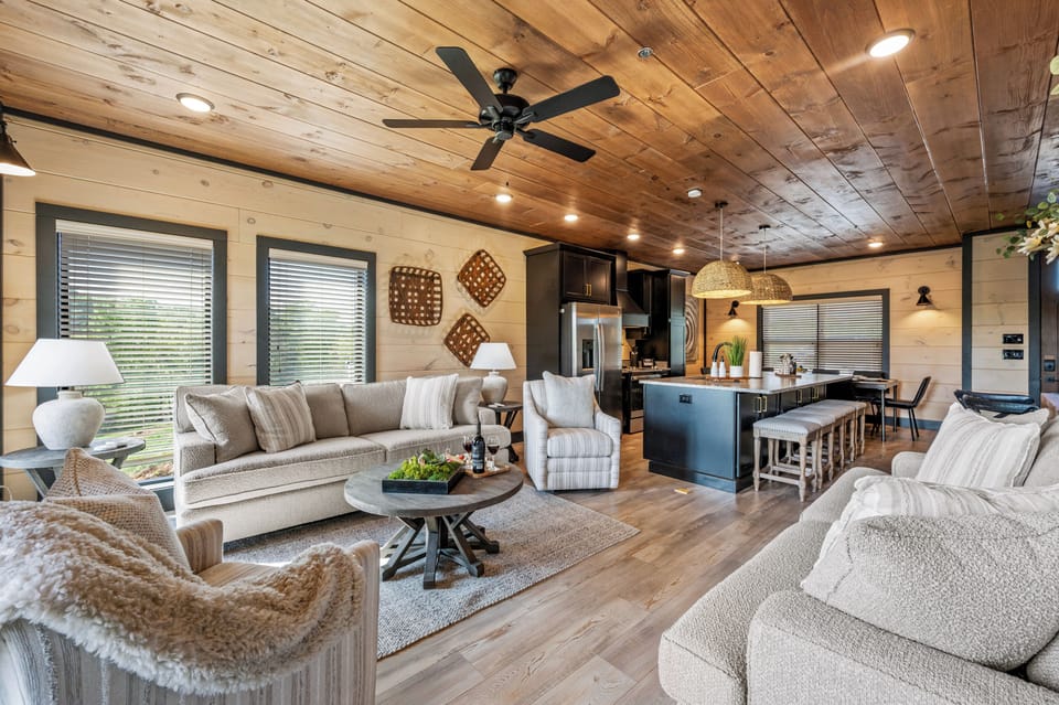 Unwind in the main floor living room with a 65” flat-screen smart TV