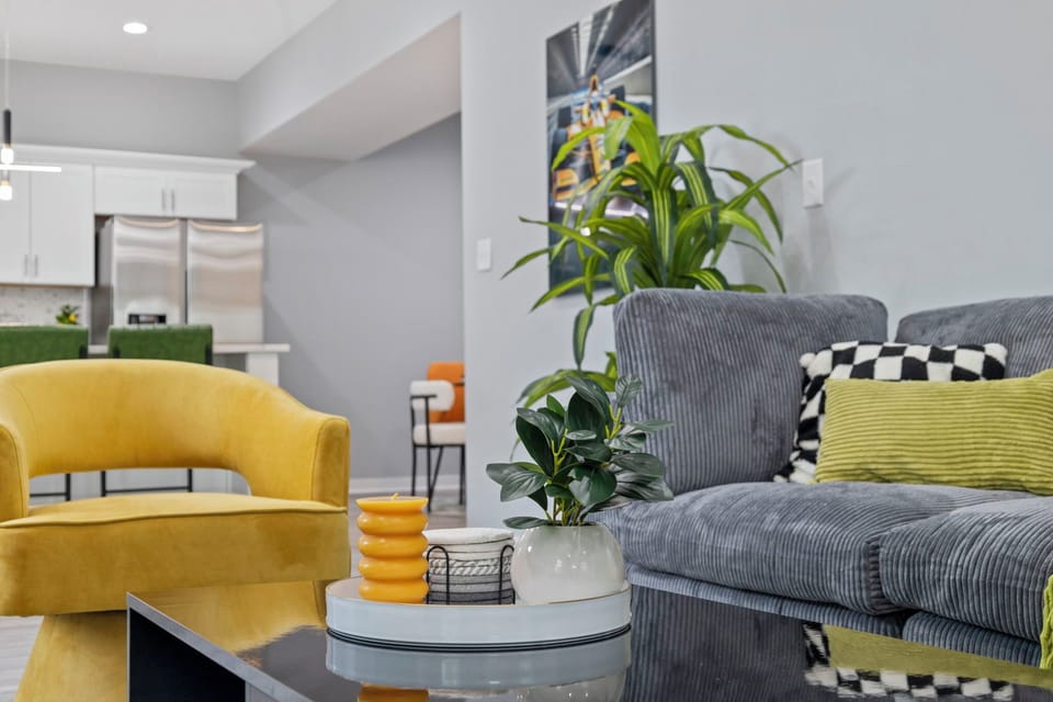 Plush couches in the living room and indoor plants