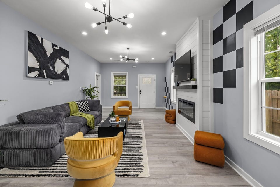 Living room with hardwood flooring and ample lighting