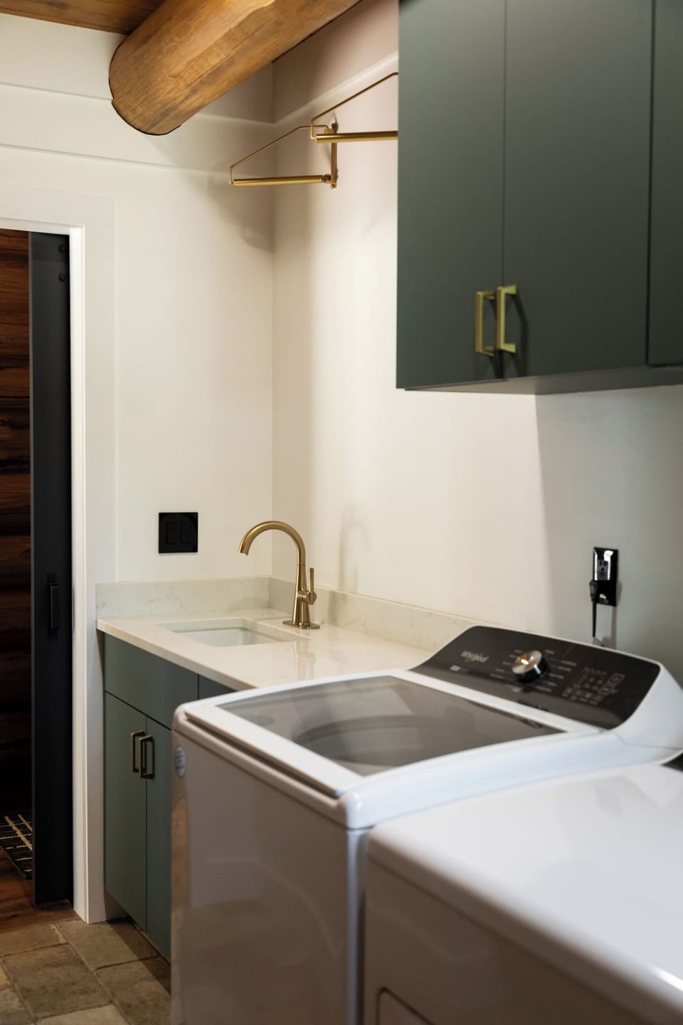Clothes hanging rack above the laundry sink