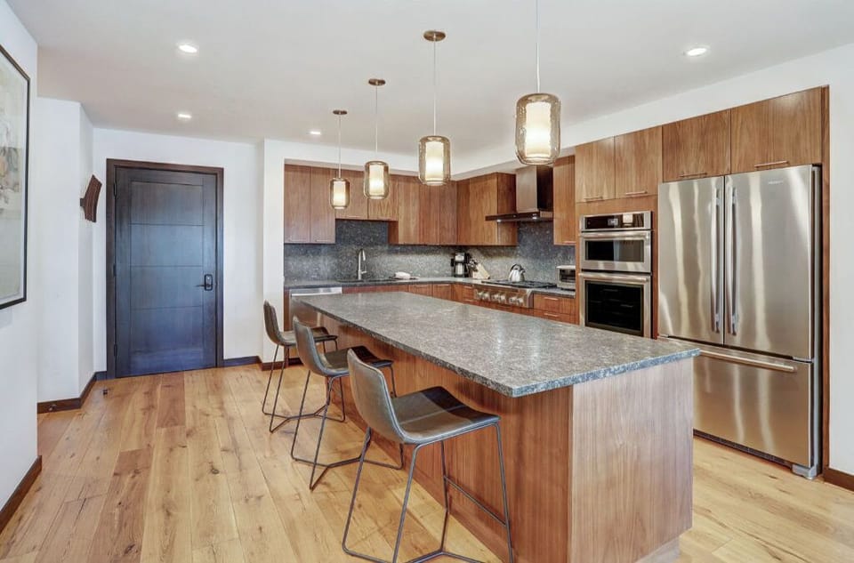 Large, open kitchen with high-end appliances and a central island.