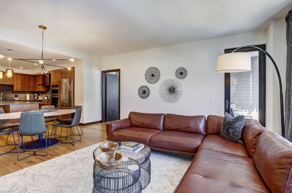 Spacious living room with modern furnishings and plenty of natural light.