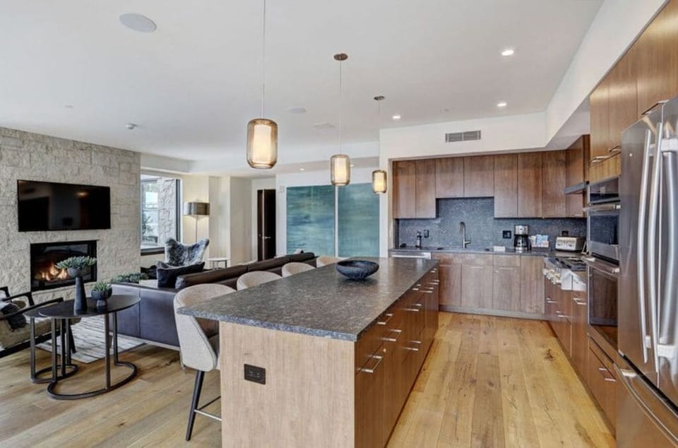 Modern open-concept kitchen and living space with high-end amenities.