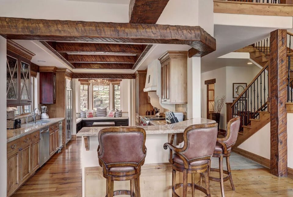Elegant kitchen with high-end finishes and a breakfast bar.