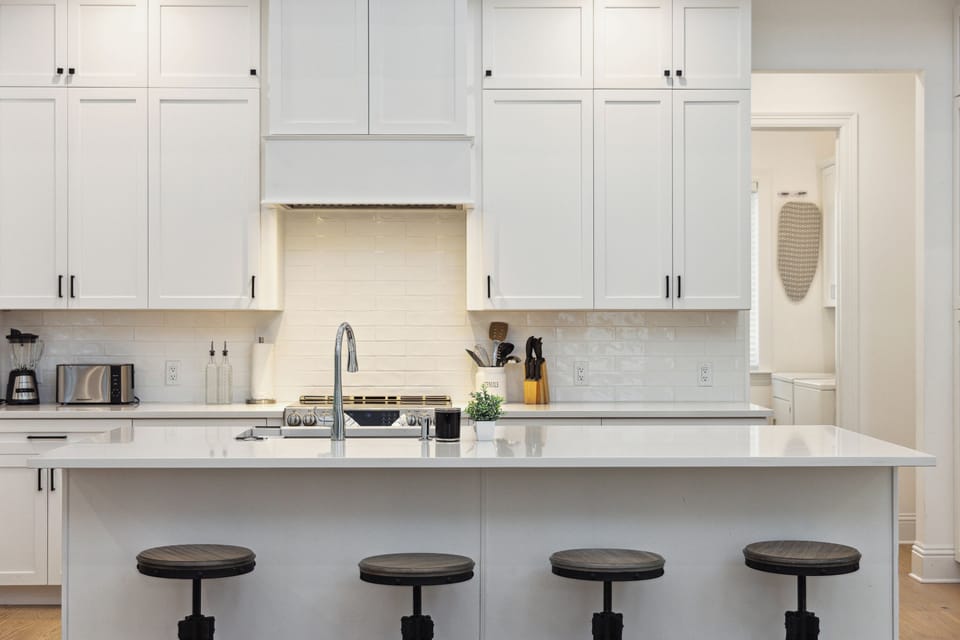 Wide marbled countertop and sleek stainless steel appliances make cooking effortless and stylish!