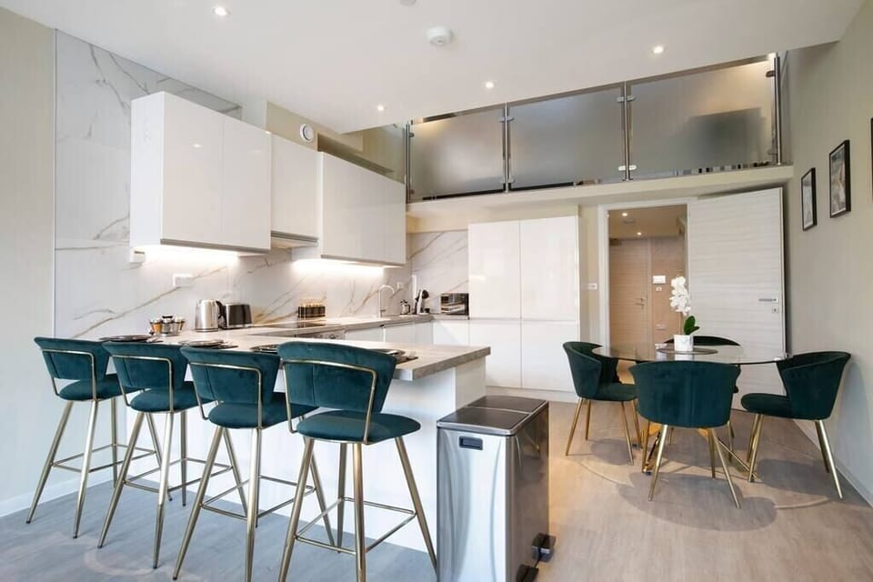 Integrated living, bedroom, and kitchen spaces in an open layout.