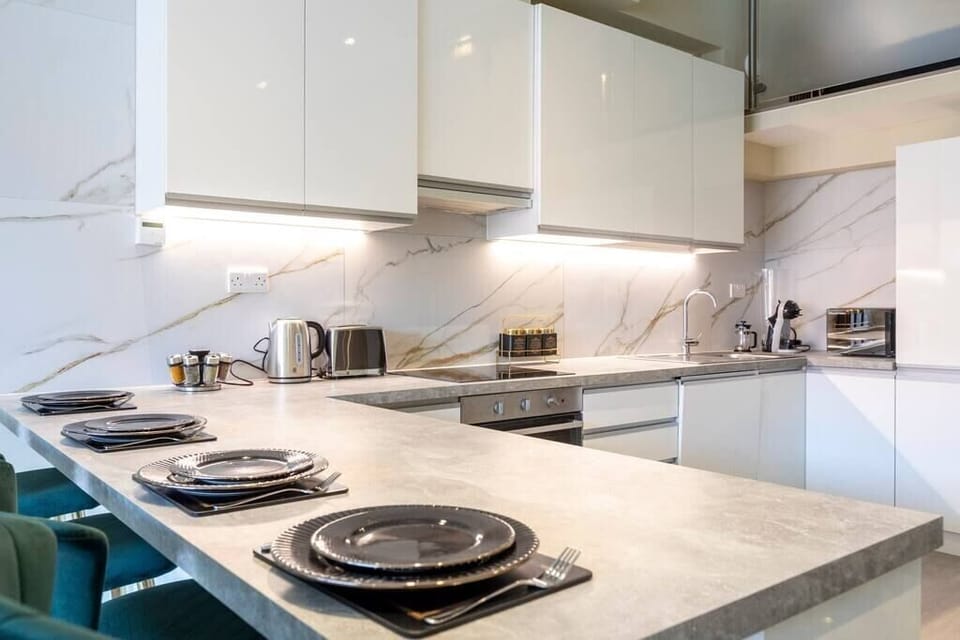 Integrated living, bedroom, and kitchen spaces in an open layout.